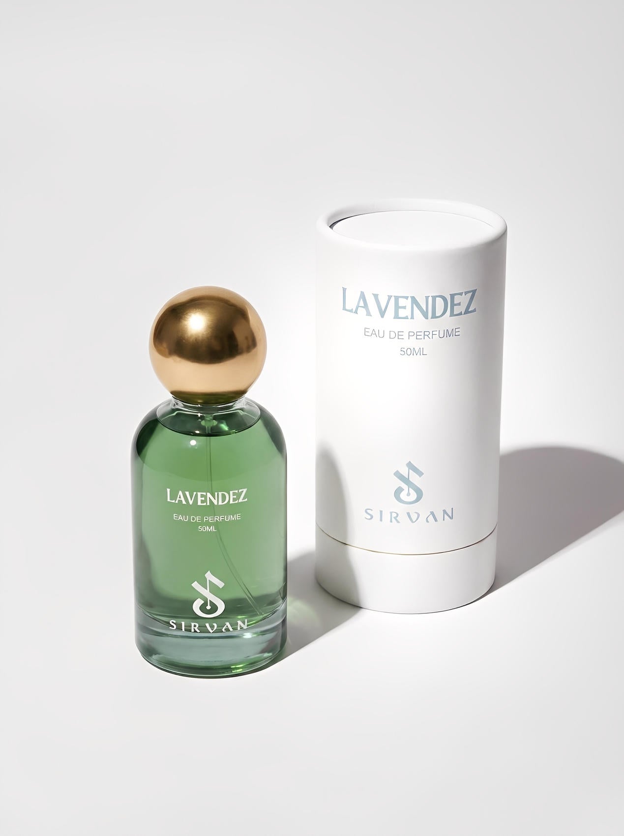 A green SIRVAN Lavendez — Eau de Parfum bottle with a gold cap sits next to its white cylindrical box.